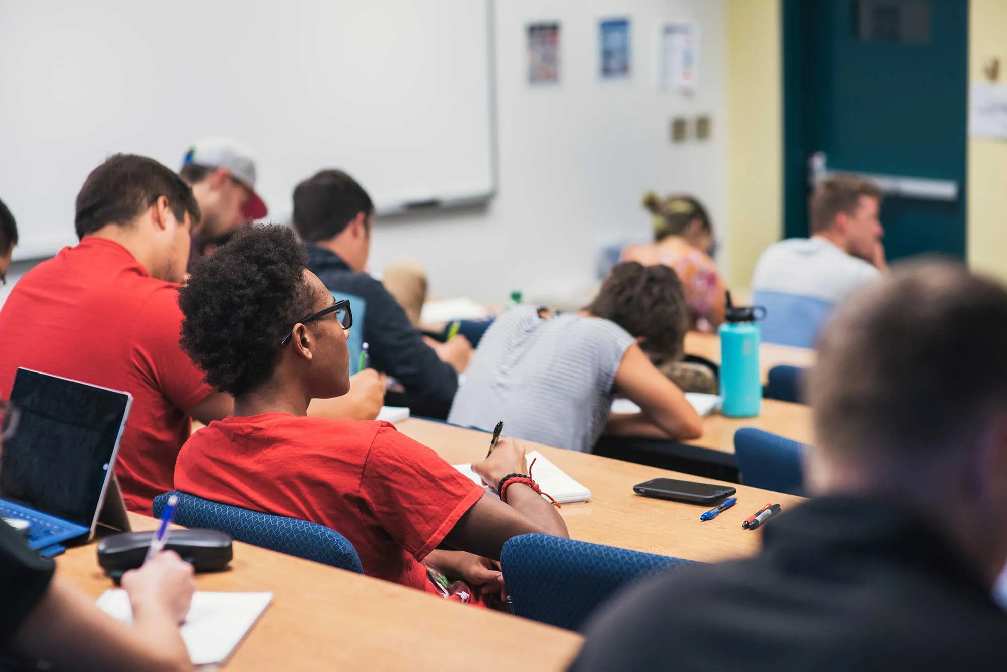 Students in a classroom taking notes