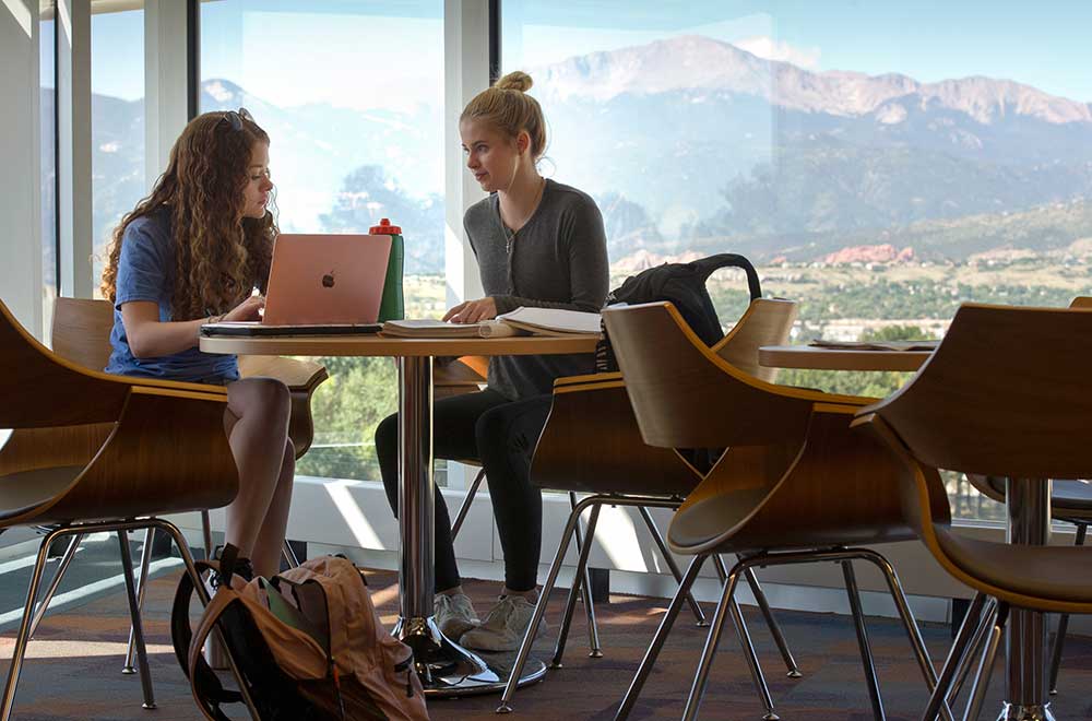 Two students studying on campus.